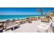 Inviting beach deck with comfortable seating offers beautiful views of the ocean and sandy beach at 5030 N Beach Rd # 1, Englewood, FL 34223