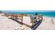 Inviting beach deck with lounge chairs offers stunning ocean views, perfect for relaxation at 5030 N Beach Rd # 1, Englewood, FL 34223