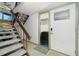 Inviting entrance features tiled floors, staircase access, and a frosted glass door at 5030 N Beach Rd # 1, Englewood, FL 34223