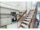 Bright kitchen features modern appliances and a staircase, offering ocean views at 5030 N Beach Rd # 1, Englewood, FL 34223