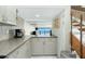 Well-lit kitchen featuring modern appliances, sleek countertops, and ocean views at 5030 N Beach Rd # 1, Englewood, FL 34223