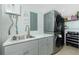 Well-organized laundry room features modern washer and dryer, utility sink and plentiful storage at 5030 N Beach Rd # 1, Englewood, FL 34223