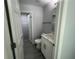 Bathroom featuring modern vanity, new floors and updated shower at 5417 Postma St, North Port, FL 34287
