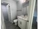 Bathroom featuring modern vanity, new floors and updated shower at 5417 Postma St, North Port, FL 34287