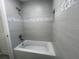 Bathroom featuring tub and custom tile work at 5417 Postma St, North Port, FL 34287