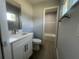Bathroom featuring modern vanity, new floors and updated shower at 5417 Postma St, North Port, FL 34287