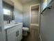 Bathroom featuring modern vanity, new floors and updated shower at 5417 Postma St, North Port, FL 34287