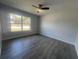 Bedroom featuring new floors, lots of natural light and a ceiling fan at 5417 Postma St, North Port, FL 34287