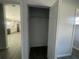 Empty closet with wood-look tile and white door at 5417 Postma St, North Port, FL 34287