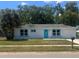 Charming single-story home with a well-maintained lawn and inviting curb appeal at 5417 Postma St, North Port, FL 34287