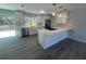 Spacious kitchen features stainless steel appliances, marble countertops, and island at 5417 Postma St, North Port, FL 34287