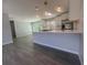 Beautiful open kitchen featuring a marble island, stainless appliances, and modern lighting at 5417 Postma St, North Port, FL 34287