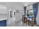 Kitchen with eat-in table, with views of the pool and patio, and white and blue decor at 56 Long Meadow Ct, Rotonda West, FL 33947