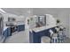 Eat-in kitchen with bar seating, stainless steel appliances, and views to the patio and pool at 56 Long Meadow Ct, Rotonda West, FL 33947