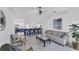 Open-concept living room with views into the kitchen and bar seating at 56 Long Meadow Ct, Rotonda West, FL 33947