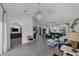 Spacious living room with tiled floors, ample natural light, and modern finishes at 56 Long Meadow Ct, Rotonda West, FL 33947