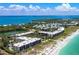An aerial view shows the Gulf side community and its close proximity to beaches and intercoastal waterways at 5700 Gulf Shores Dr # A312, Boca Grande, FL 33921