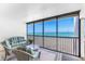 Relax on this cozy screened balcony with stunning ocean views and comfortable seating at 5700 Gulf Shores Dr # A312, Boca Grande, FL 33921