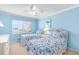 Cozy bedroom featuring twin beds with matching blue and white bedding, brightened by natural light at 5700 Gulf Shores Dr # A312, Boca Grande, FL 33921