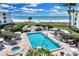 This luxurious pool offers a tranquil escape with beautiful beach views and lush landscaping at 5700 Gulf Shores Dr # A312, Boca Grande, FL 33921