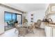 Bright dining area with ocean views and access to the screened lanai at 5700 Gulf Shores Dr # A312, Boca Grande, FL 33921