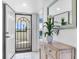 Light and bright entryway with tile flooring and access to the screened lanai at 5700 Gulf Shores Dr # A312, Boca Grande, FL 33921