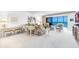 Bright living room featuring a view of the ocean and access to the screened lanai at 5700 Gulf Shores Dr # A312, Boca Grande, FL 33921