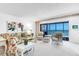 Open-concept living area featuring comfortable seating and a view of the ocean at 5700 Gulf Shores Dr # A312, Boca Grande, FL 33921
