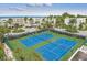 Aerial view of pristine tennis courts with ocean views, surrounded by lush landscaping at 5700 Gulf Shores Dr # A312, Boca Grande, FL 33921