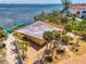 Waterfront home featuring lush landscaping, a private dock, and stunning ocean views at 6029 Manasota Key Rd, Englewood, FL 34223