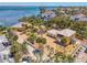 Expansive aerial shot of the home, highlighting its prime waterfront location and large lot at 6029 Manasota Key Rd, Englewood, FL 34223