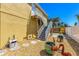 Backyard area with shell landscaping, outdoor accents, and stairs to the second story at 6029 Manasota Key Rd, Englewood, FL 34223