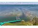 Dock and lift on the water provide opportunities to enjoy coastal living at 6029 Manasota Key Rd, Englewood, FL 34223