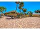 Expansive brick driveway and tropical landscaping complement this well-maintained home with ample parking at 6029 Manasota Key Rd, Englewood, FL 34223