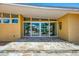 Inviting front entrance featuring glass doors offering views, with flagstone entry at 6029 Manasota Key Rd, Englewood, FL 34223
