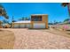 Beautiful home featuring a paver driveway and three-car garage, perfect for beach living at 6029 Manasota Key Rd, Englewood, FL 34223
