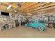 Spacious garage with car lift, workbench, storage cabinets, and ample space at 6029 Manasota Key Rd, Englewood, FL 34223