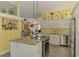 Spacious kitchen boasts granite countertops, stainless steel appliances, and access to multiple living areas at 6029 Manasota Key Rd, Englewood, FL 34223