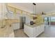 Bright and spacious kitchen boasts granite countertops, stainless steel appliances, and a water view at 6029 Manasota Key Rd, Englewood, FL 34223