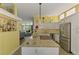 Updated kitchen features granite countertops, stainless steel appliances, and an open floorplan at 6029 Manasota Key Rd, Englewood, FL 34223