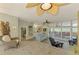 Inviting living area with comfortable chairs, tiled flooring, and view of the pool at 6029 Manasota Key Rd, Englewood, FL 34223