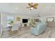 Open concept living room and dining room filled with natural light and stylish decor at 6029 Manasota Key Rd, Englewood, FL 34223