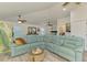 Spacious living room featuring a large sectional sofa, modern decor, and lots of natural light at 6029 Manasota Key Rd, Englewood, FL 34223