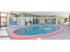 Large enclosed pool area with seating, great views and multiple access points to the home at 6029 Manasota Key Rd, Englewood, FL 34223