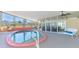 Inviting enclosed pool area with seating, ceiling fans, and view of the outdoors at 6029 Manasota Key Rd, Englewood, FL 34223