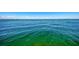 Scenic ocean view with shades of blue and turquoise water and clear blue sky at 6029 Manasota Key Rd, Englewood, FL 34223