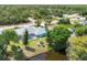 Aerial view of home with screened in pool and backyard on canal at 6062 Spinnaker Blvd, Englewood, FL 34224