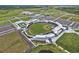 Expansive aerial view of the ballpark including multiple parking lots and baseball fields at 6062 Spinnaker Blvd, Englewood, FL 34224