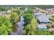 Stunning aerial shot of the property backing up to a tranquil canal at 6062 Spinnaker Blvd, Englewood, FL 34224
