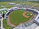 High aerial of baseball field and stadium; manicured field, many seats at 6062 Spinnaker Blvd, Englewood, FL 34224